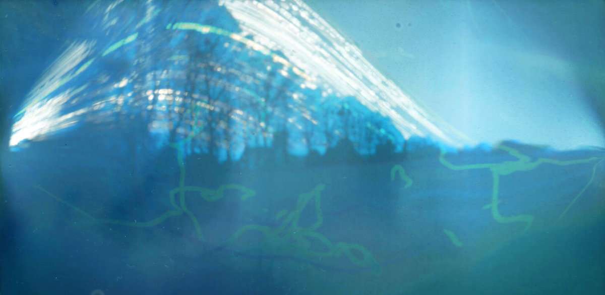 Solargraph of a field with a church in the background